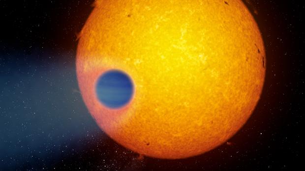 Representación artística del exoplaneta gigante WASP-69b que pierde su atmósfera en forma de cola